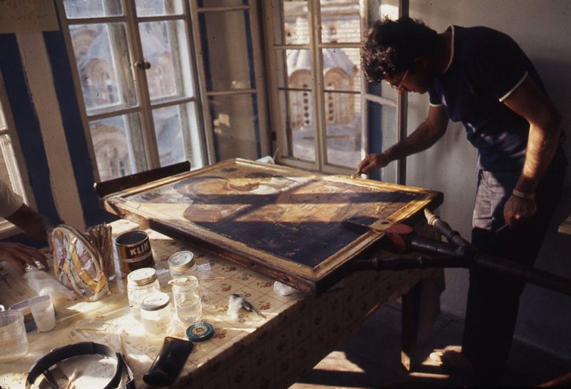 Tsaousis cleaning an icon at Hilandar Monastery, c. 1971, photo by Carroll Wales 